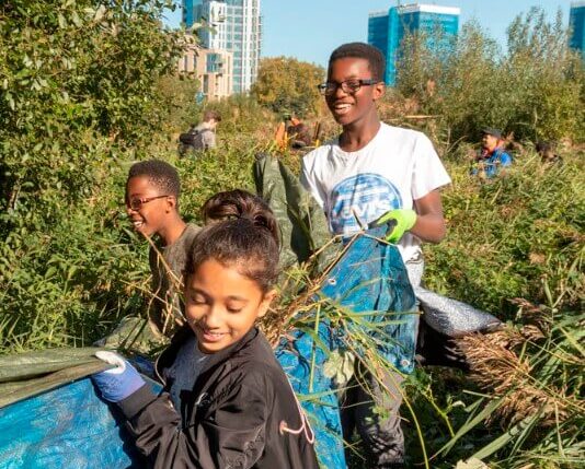 Children volunteering in nature with ActionFunder