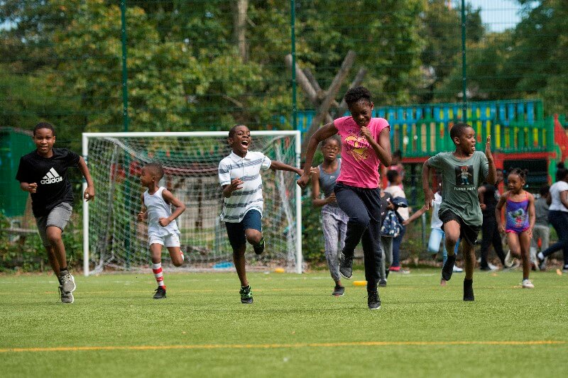 Children running at holiday youth charity