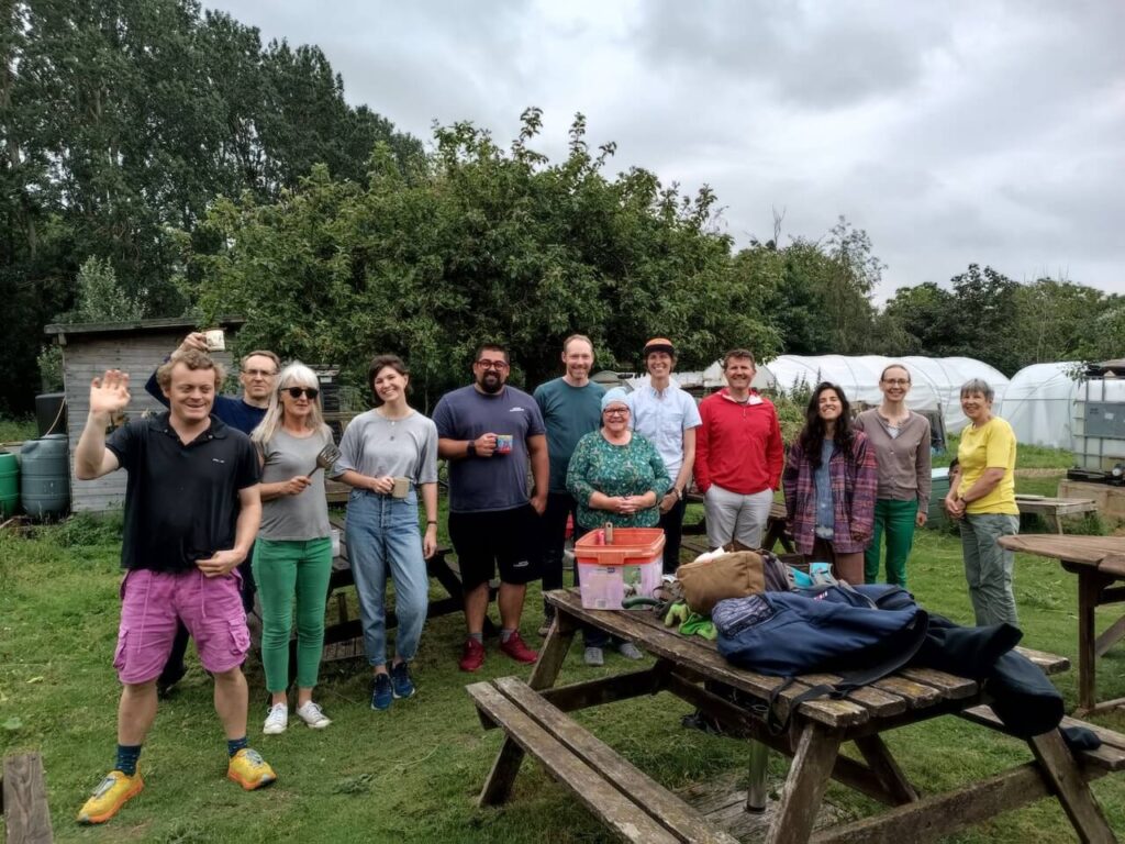 Volunteers smiling at a community gardens