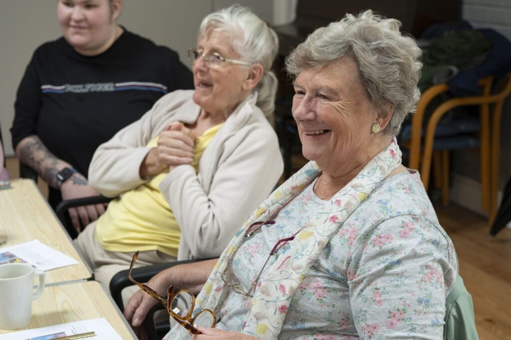 Elderly ladies laughing at a care home after being funded by ActionFunder